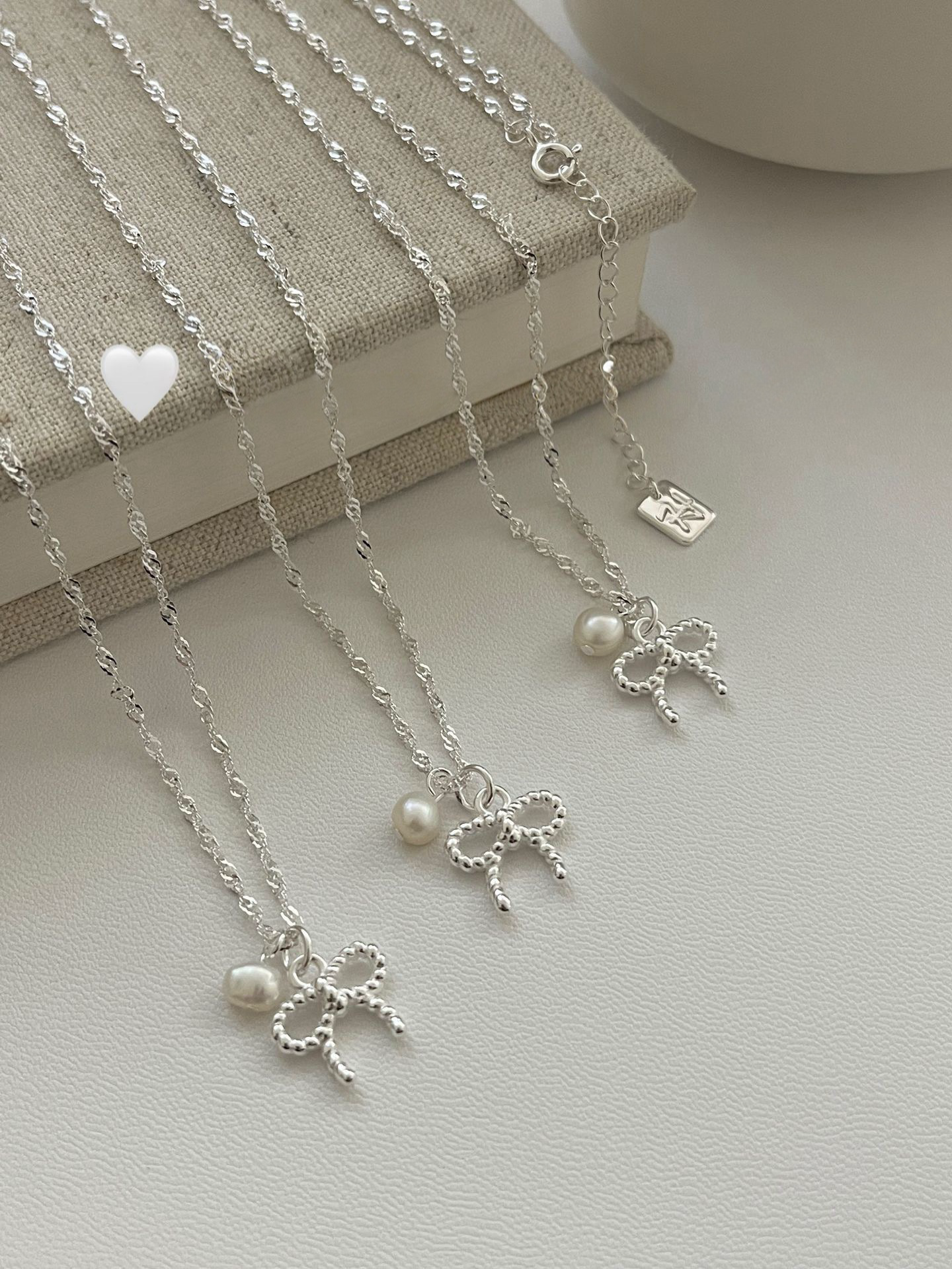 Twist Bow & Pearl Pendant Necklace