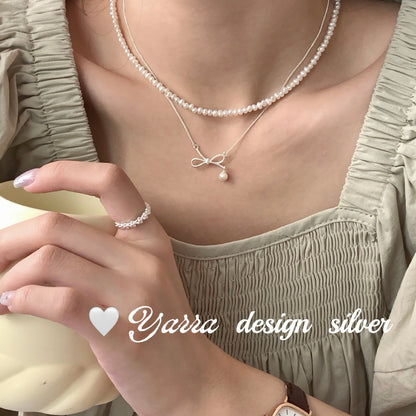 Twist Bow & Pearl Pendant Necklace