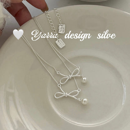 Twist Bow & Pearl Pendant Necklace