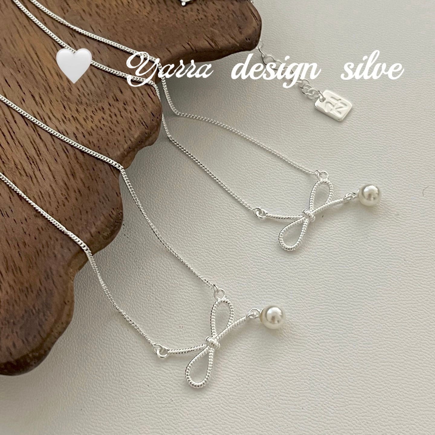 Twist Bow & Pearl Pendant Necklace