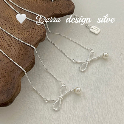 Twist Bow & Pearl Pendant Necklace